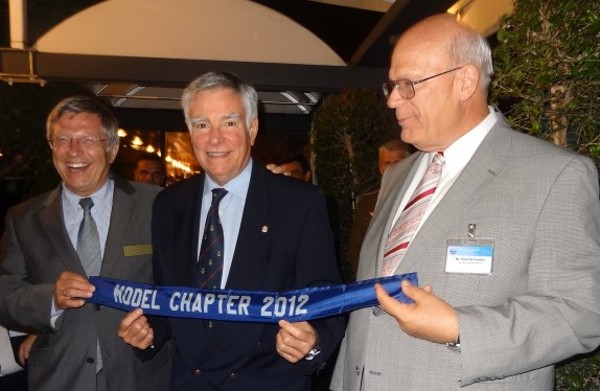 Schneider (r) and Maj. Gen. Klaus-Peter Treche, GEA (Ret.) (l), general manager of AFCEA Europe, present the Model Chapter Award to Rear Adm. Carlos R. Rodolfo, PON (Ret.), Portugal Chapter President, in May.